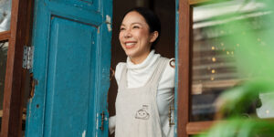 woman smiling at door